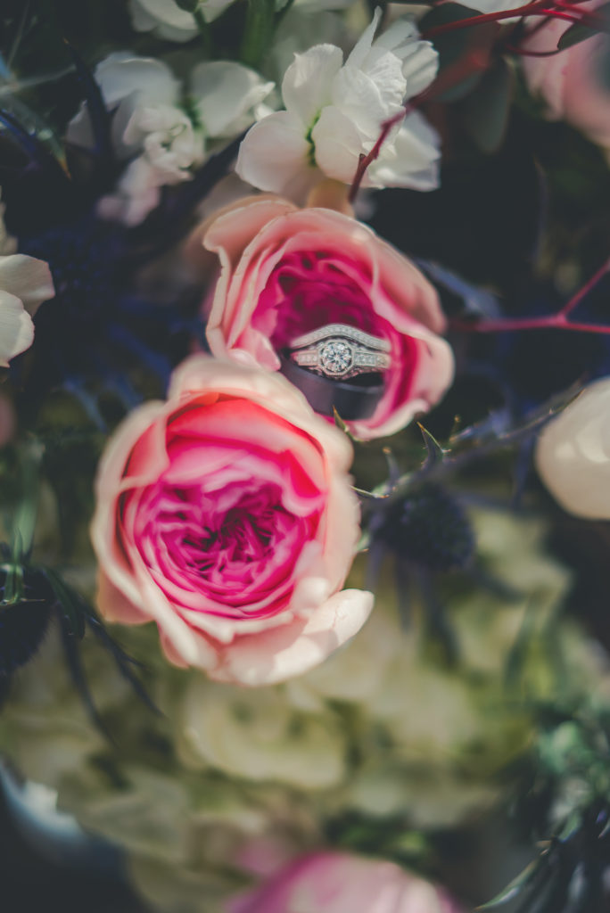 wedding rings in flowers at Abernethy Center
